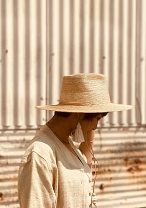 Woman Wearing Weaved Hat