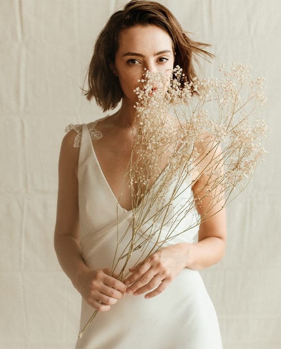 Wildbride-standing-in-off-white-dress